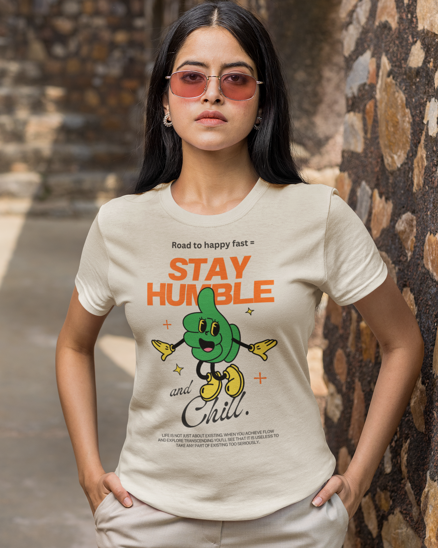 Woman wearing a t-shirt with 'Stay Humble and Chill' design outdoors. Xlr8happy brand, sold by Hapilumi. Part of the how to be happy collection.
